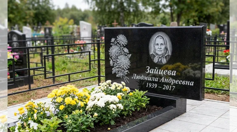 Памятник с гравировкой хризантем — выполненная работа «Зайцева» в Новом Уренгое