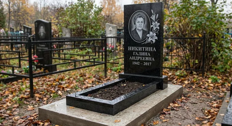 Памятник с гравировкой лилий — выполненная работа «Никитина» в Новом Уренгое