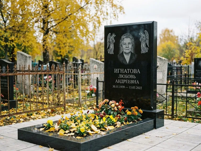 Памятник с гравировкой ангела — гравировка двух ангелов по сторонам портрета, работа «Игнатова» в Новом Уренгое