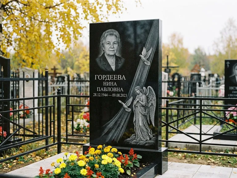 Памятник с гравировкой ангела — гравировка ангела с голубем по диагонали стелы, работа «Гордеева» в Новом Уренгое